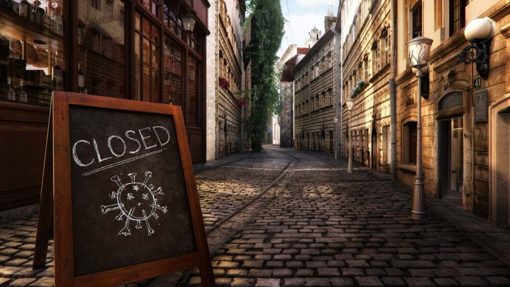 Deserted street with COVID sign