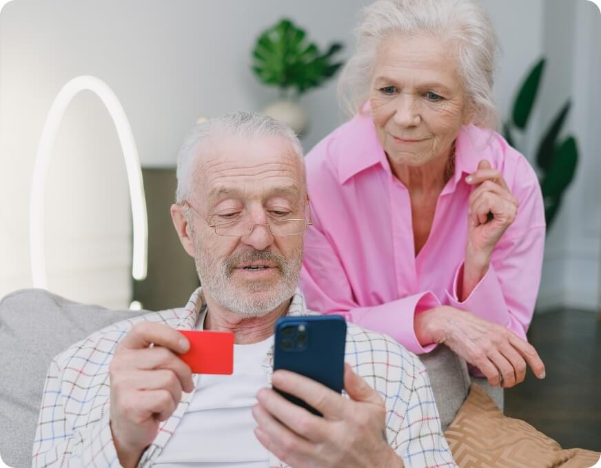 Couple on phone with credit card