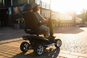 Mobility scooter travelling on a road