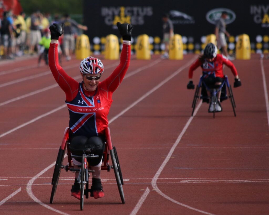 Disabled athlete winning a race on a racing wheelchair