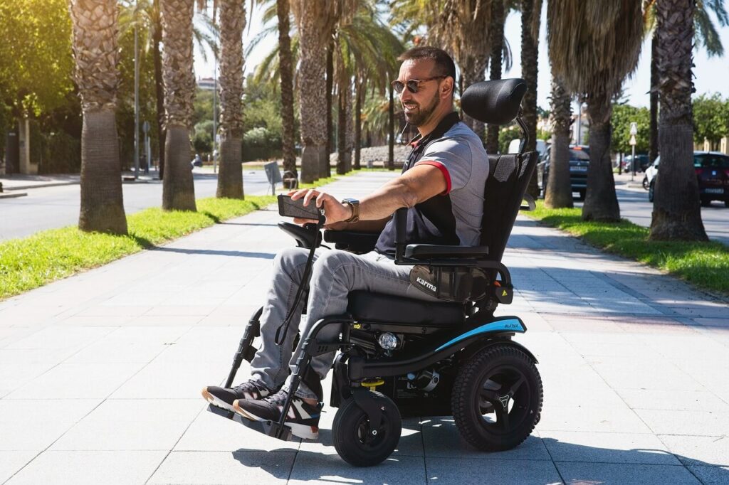 Electric wheelchair user on holiday